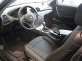 BMW 1 серия,  хэтчбек,  2012 г. в.,  механика,  1,598 л,  цвет:  черный в городе Москва, фото 1, Московская область